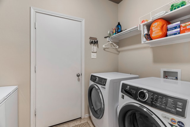 washroom with laundry area and washing machine and dryer