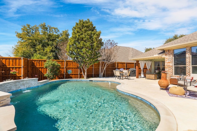 view of swimming pool featuring a patio area, a fenced backyard, and a fenced in pool