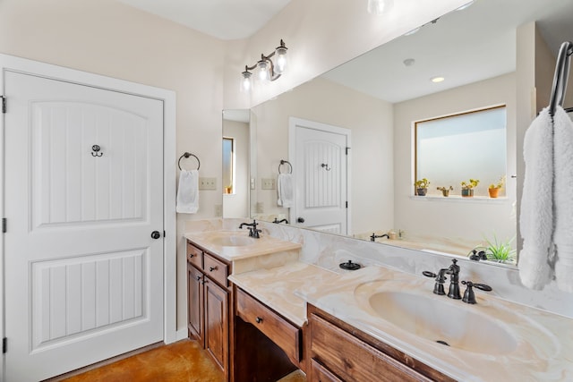 full bath featuring a sink and double vanity