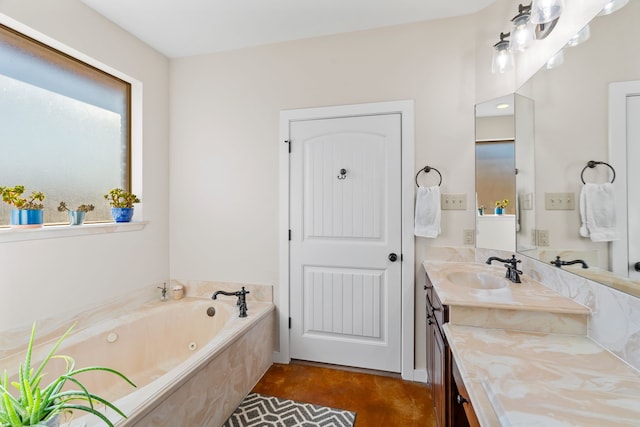 bathroom featuring vanity and a tub with jets