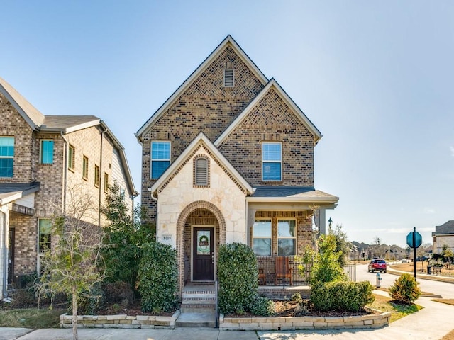 view of front of home featuring stone siding and brick siding