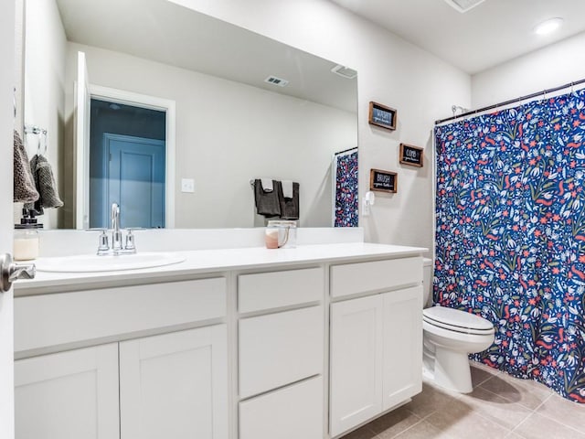 bathroom featuring toilet, tile patterned flooring, vanity, and a shower with curtain