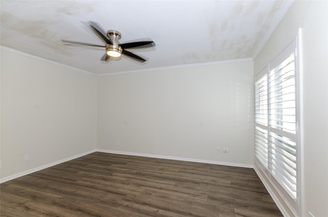 unfurnished room with dark wood-style floors, crown molding, baseboards, and ceiling fan