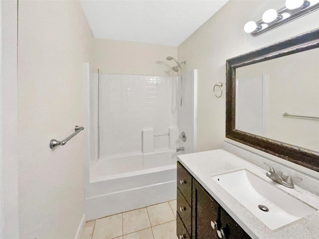 bathroom with bathing tub / shower combination, vanity, and tile patterned floors