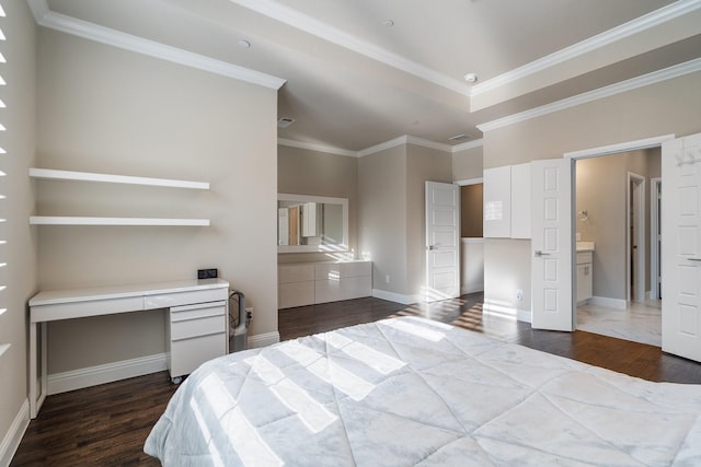 bedroom with crown molding, built in study area, dark wood finished floors, and baseboards