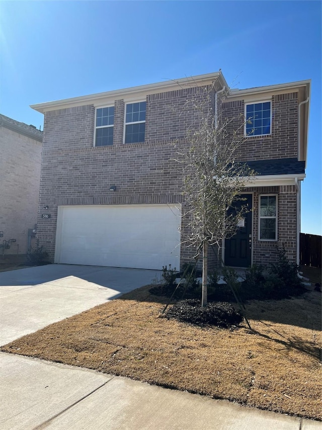 view of front of house with a garage, concrete driveway, and brick siding