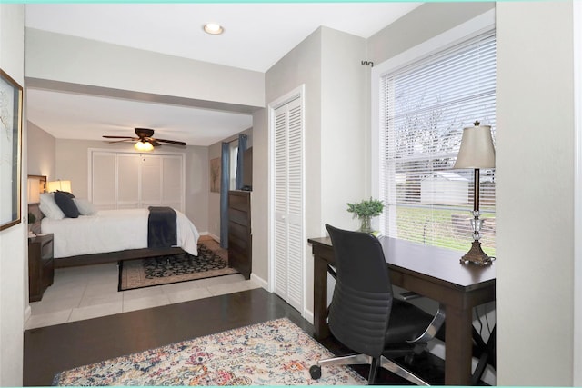 bedroom featuring recessed lighting, multiple windows, baseboards, and tile patterned floors