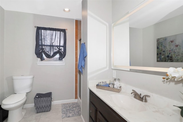 bathroom featuring baseboards, toilet, tile patterned flooring, an enclosed shower, and vanity