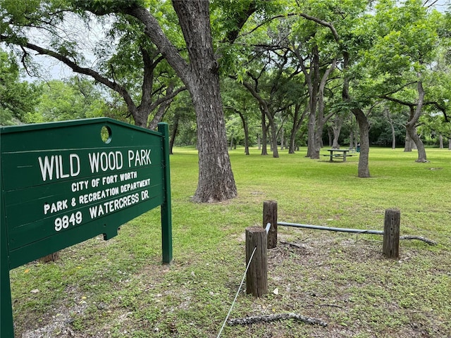 view of property's community with a lawn