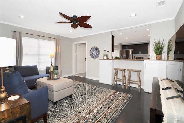 living room with ornamental molding, dark wood finished floors, and visible vents