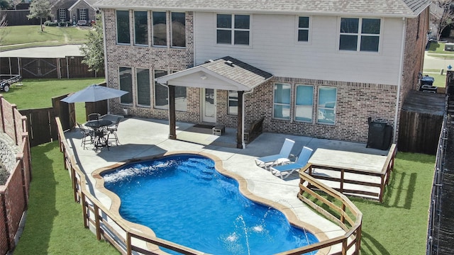 view of pool featuring a fenced in pool, a fenced backyard, a patio, and a lawn