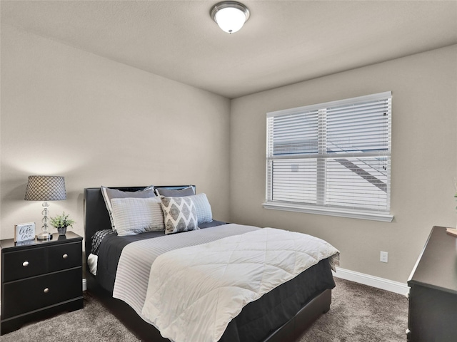 carpeted bedroom with baseboards