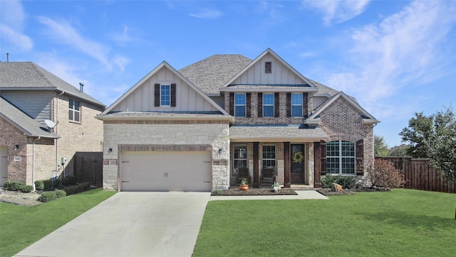 craftsman-style home with roof with shingles, concrete driveway, board and batten siding, fence, and a front lawn