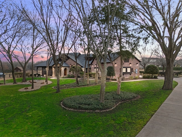 view of home's community featuring a lawn