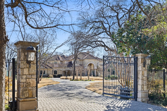 view of gate with fence