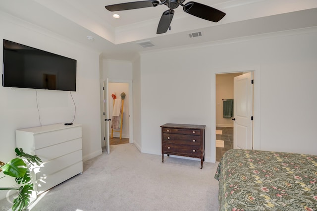 bedroom featuring light carpet, visible vents, ornamental molding, a tray ceiling, and recessed lighting