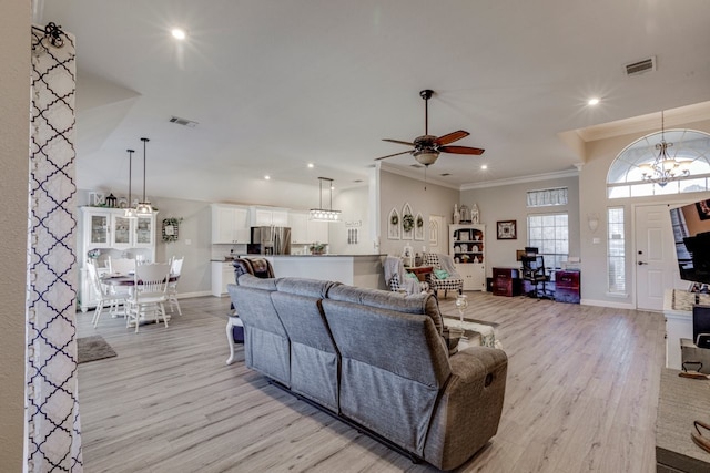 living area featuring light wood-style flooring, visible vents, crown molding, and recessed lighting