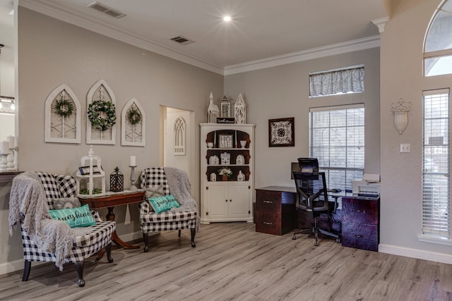 office area with ornamental molding, visible vents, and wood finished floors