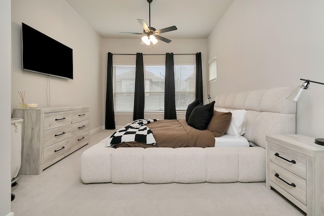 bedroom with ceiling fan and light colored carpet