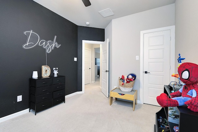 interior space featuring a ceiling fan, visible vents, and baseboards