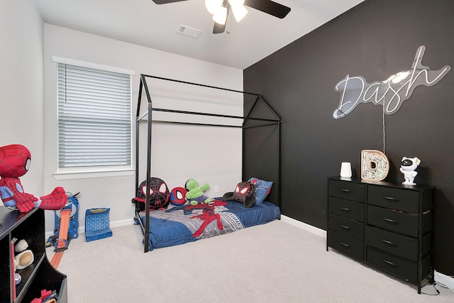 bedroom with a ceiling fan, carpet, visible vents, and baseboards