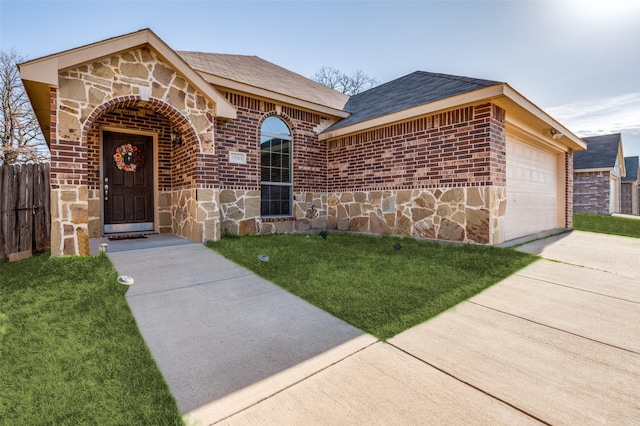 view of front facade featuring stone siding, brick siding, and concrete driveway