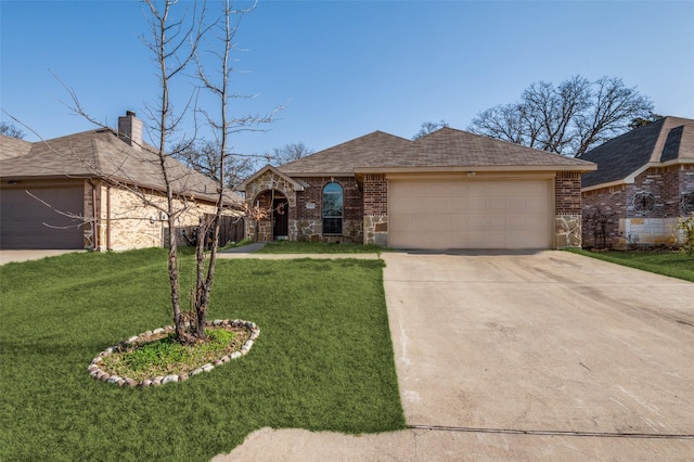 view of front of home featuring driveway, stone siding, an attached garage, a front yard, and brick siding