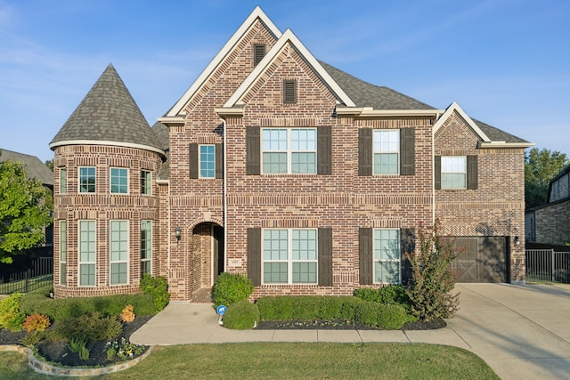 view of front of property with a garage, driveway, brick siding, and roof with shingles