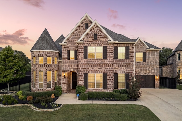 view of front of home featuring a front yard, brick siding, and driveway