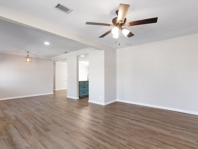 spare room featuring baseboards, visible vents, ceiling fan, wood finished floors, and recessed lighting