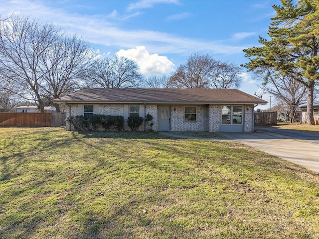 single story home featuring fence, a front lawn, concrete driveway, and brick siding