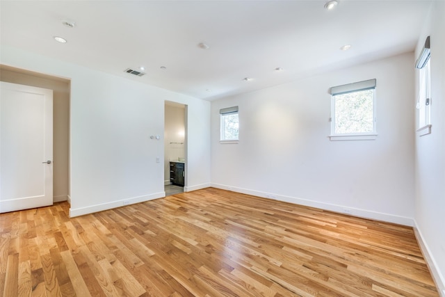 6007 Club Oaks Dr, Dallas, TX 75248 - spare room featuring light wood finished floors, baseboards, and recessed lighting