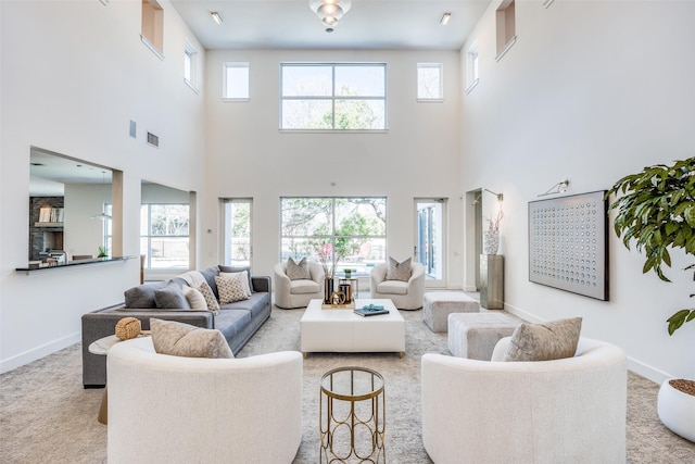 6007 Club Oaks Dr, Dallas, TX 75248 - living room featuring a towering ceiling, baseboards, and carpet flooring