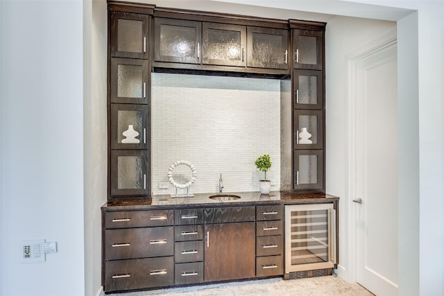 6007 Club Oaks Dr, Dallas, TX 75248 - bar featuring wine cooler, a sink, decorative backsplash, and baseboards