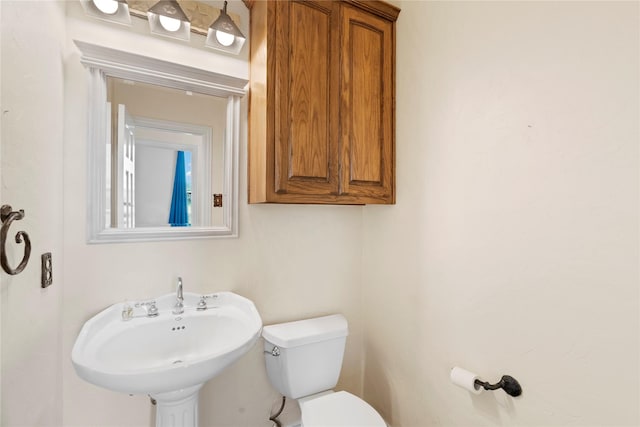 bathroom with a sink and toilet