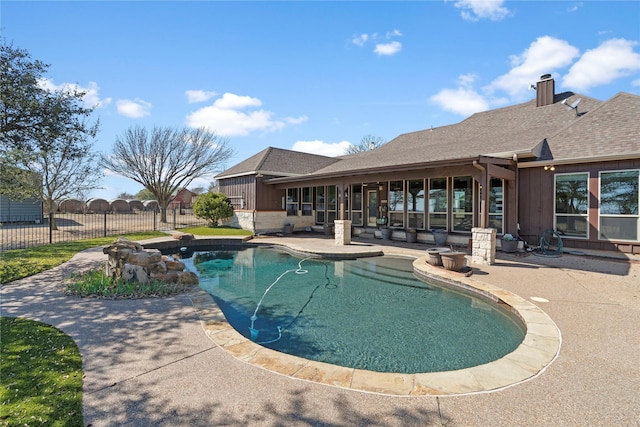 view of pool with a fenced in pool, a patio area, and fence