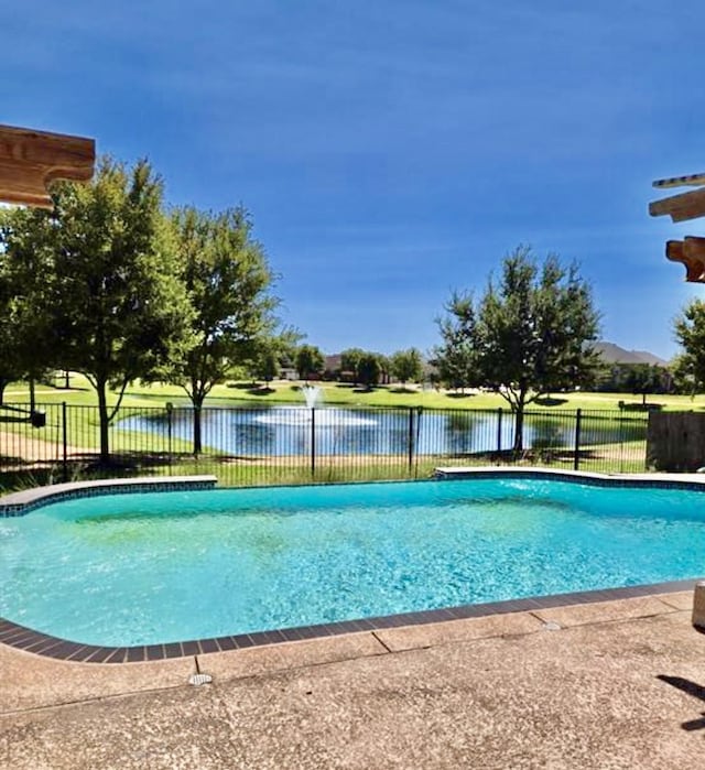 view of pool featuring a water view, fence, and a fenced in pool