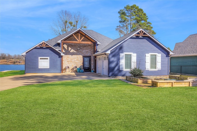 view of front of home with stone siding, a front yard, and a vegetable garden