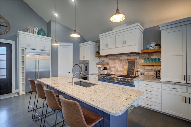 kitchen featuring appliances with stainless steel finishes, white cabinetry, hanging light fixtures, and open shelves