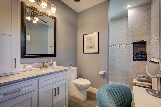 full bath with ceiling fan, toilet, vanity, and baseboards