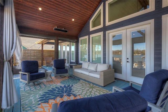 sunroom with lofted ceiling, french doors, and wood ceiling