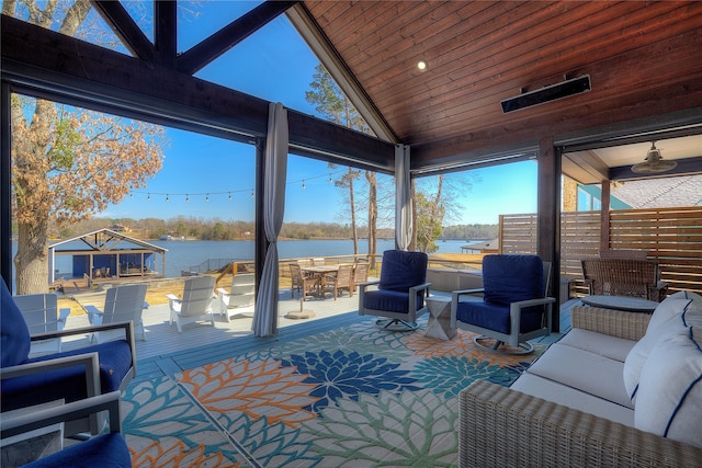 sunroom with vaulted ceiling, a water view, and wooden ceiling