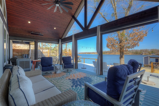 sunroom featuring a ceiling fan, lofted ceiling, wooden ceiling, and a water view