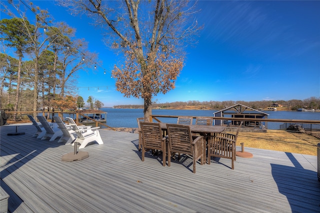 wooden deck with a water view