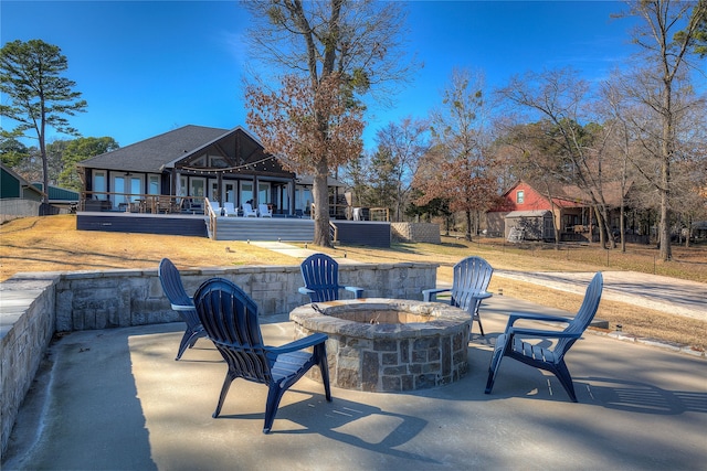 view of patio / terrace featuring an outdoor fire pit