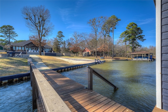 dock area with a water view and a gazebo