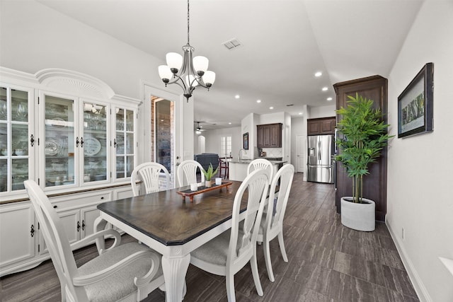 dining space featuring recessed lighting, visible vents, baseboards, and ceiling fan with notable chandelier