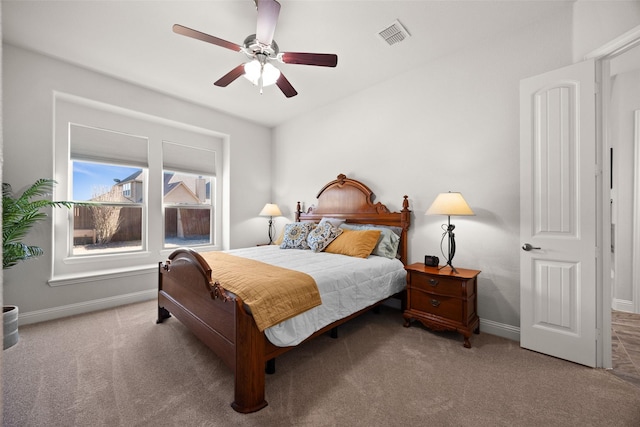 bedroom featuring light carpet, baseboards, and visible vents