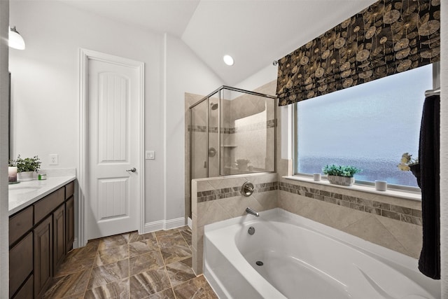 full bath featuring lofted ceiling, a garden tub, vanity, a shower stall, and recessed lighting