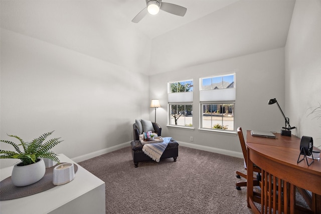 carpeted office space featuring a ceiling fan and baseboards